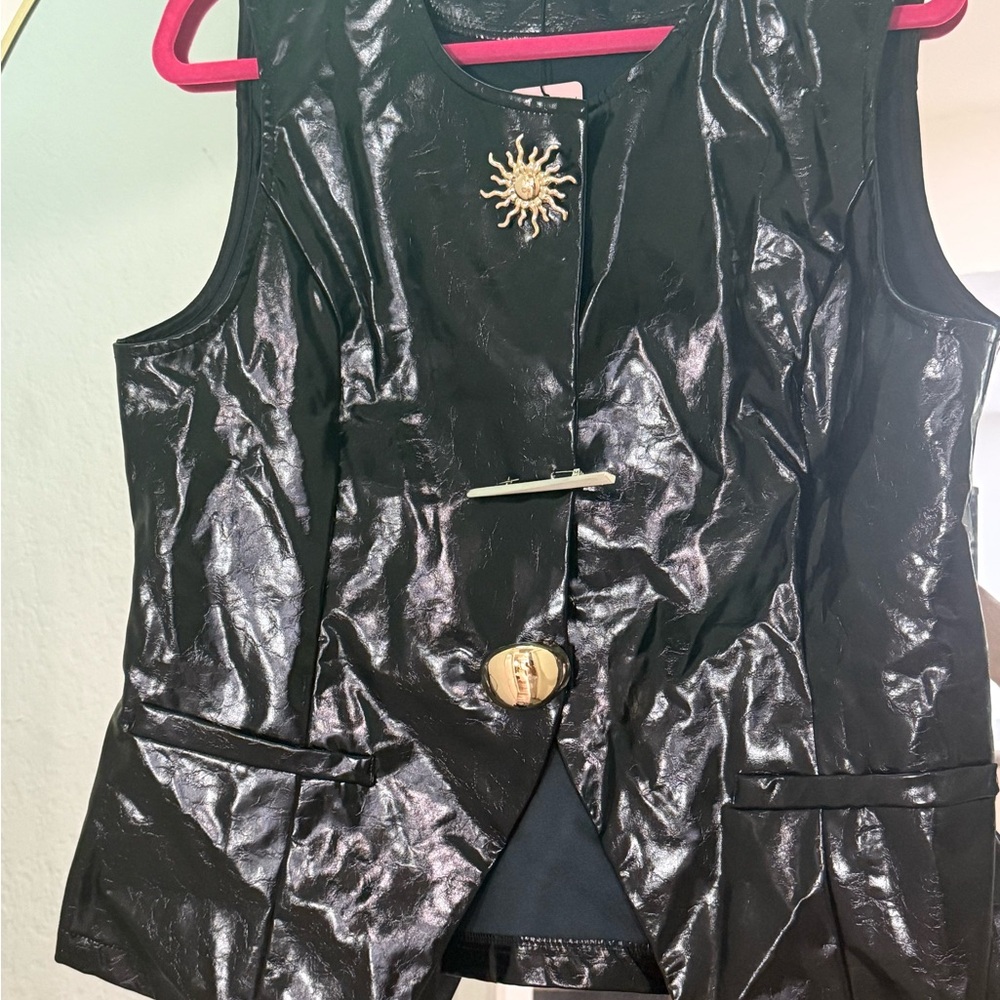 Shiny Black Sleeveless Vest with Sunburst Detail